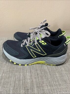 New Balance women’s Navy and Neon Yellow Athletic Sneakers